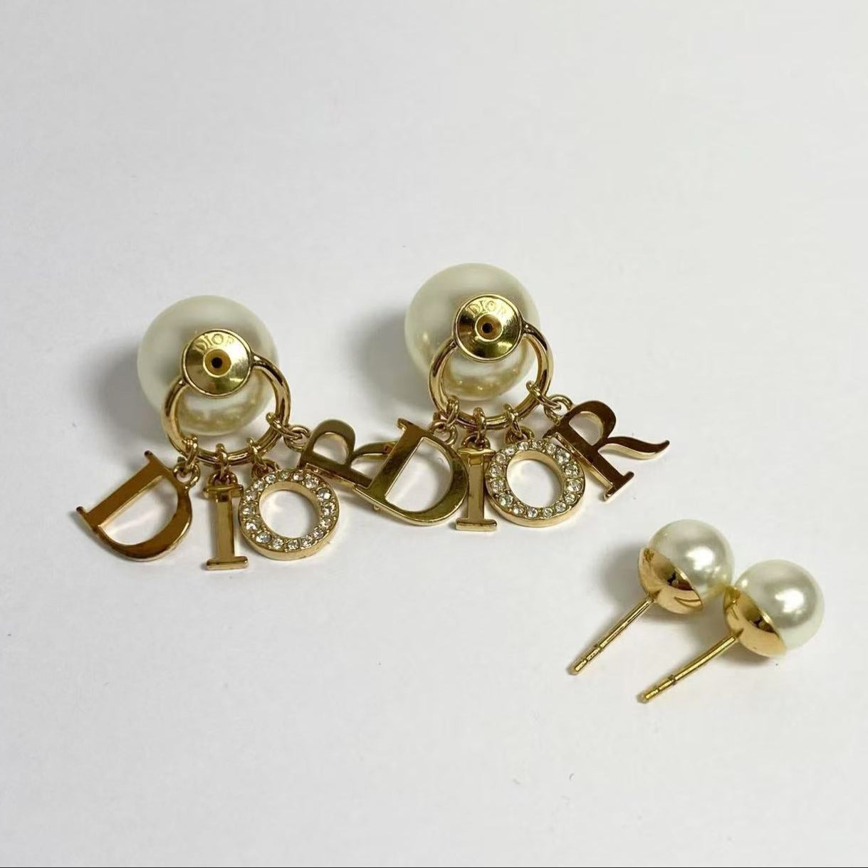 DIOR logo gold Tribales resin pearl earrings